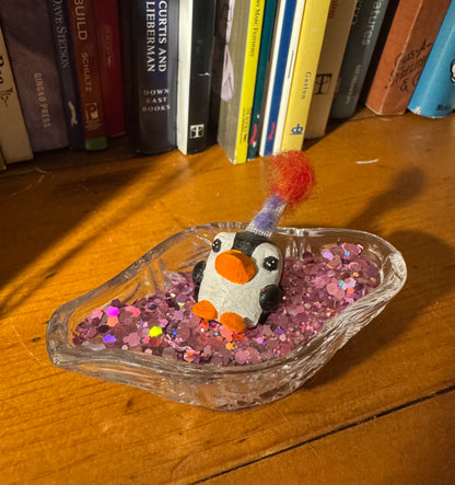 another party penguin in a confetti pool