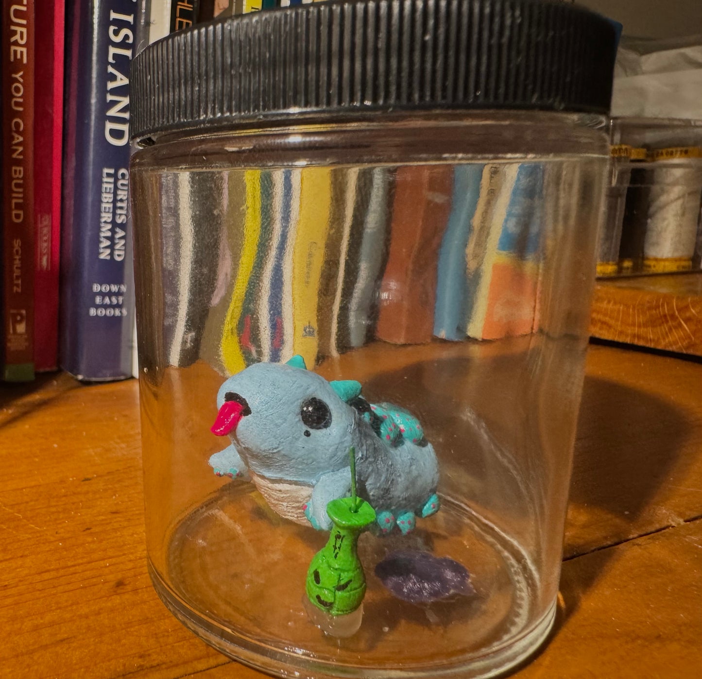 cutie blue creature in a jar