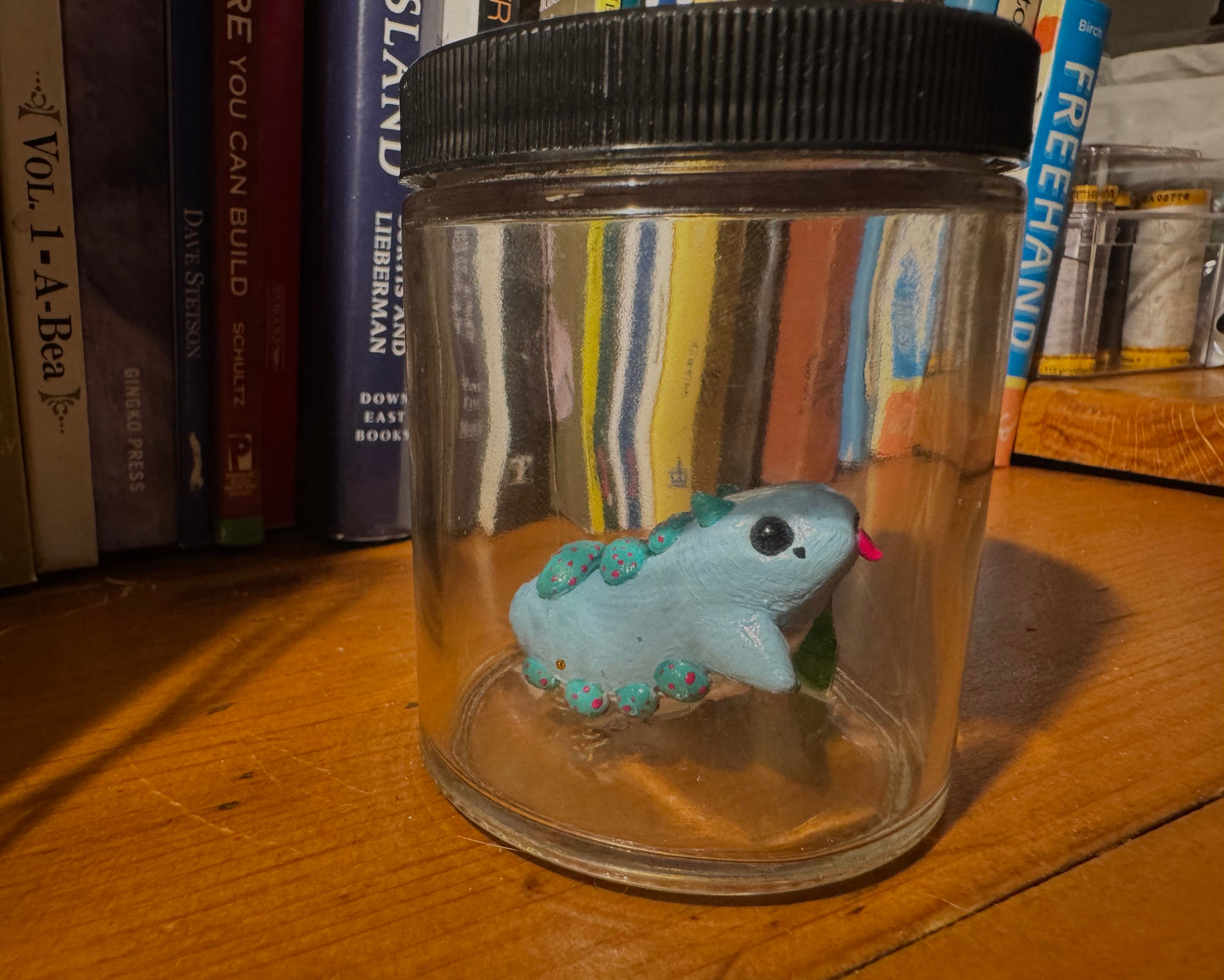 cutie blue creature in a jar