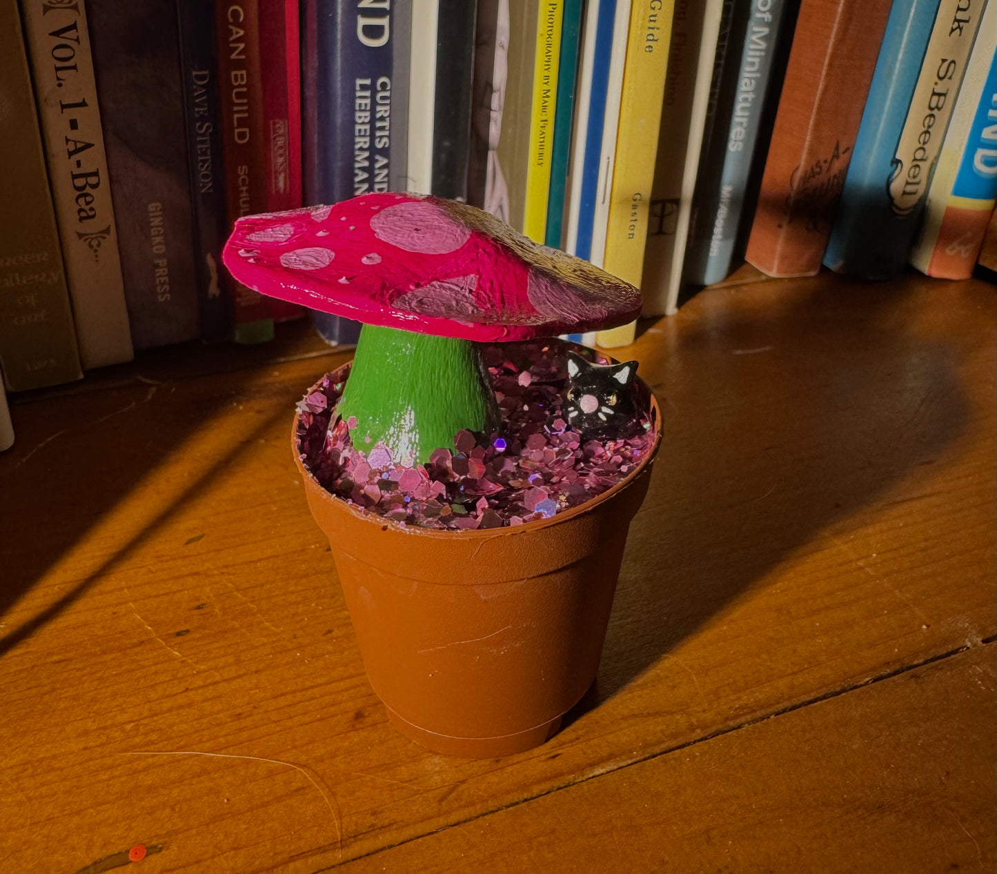 cat in a mushroom planter