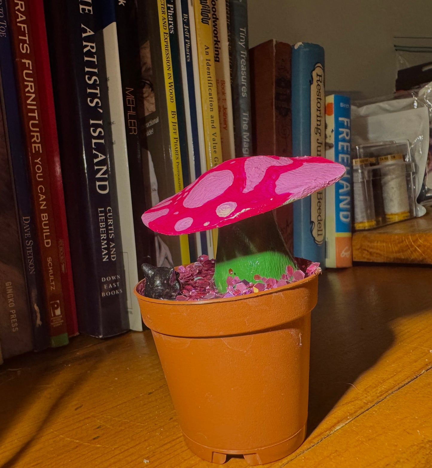 cat in a mushroom planter