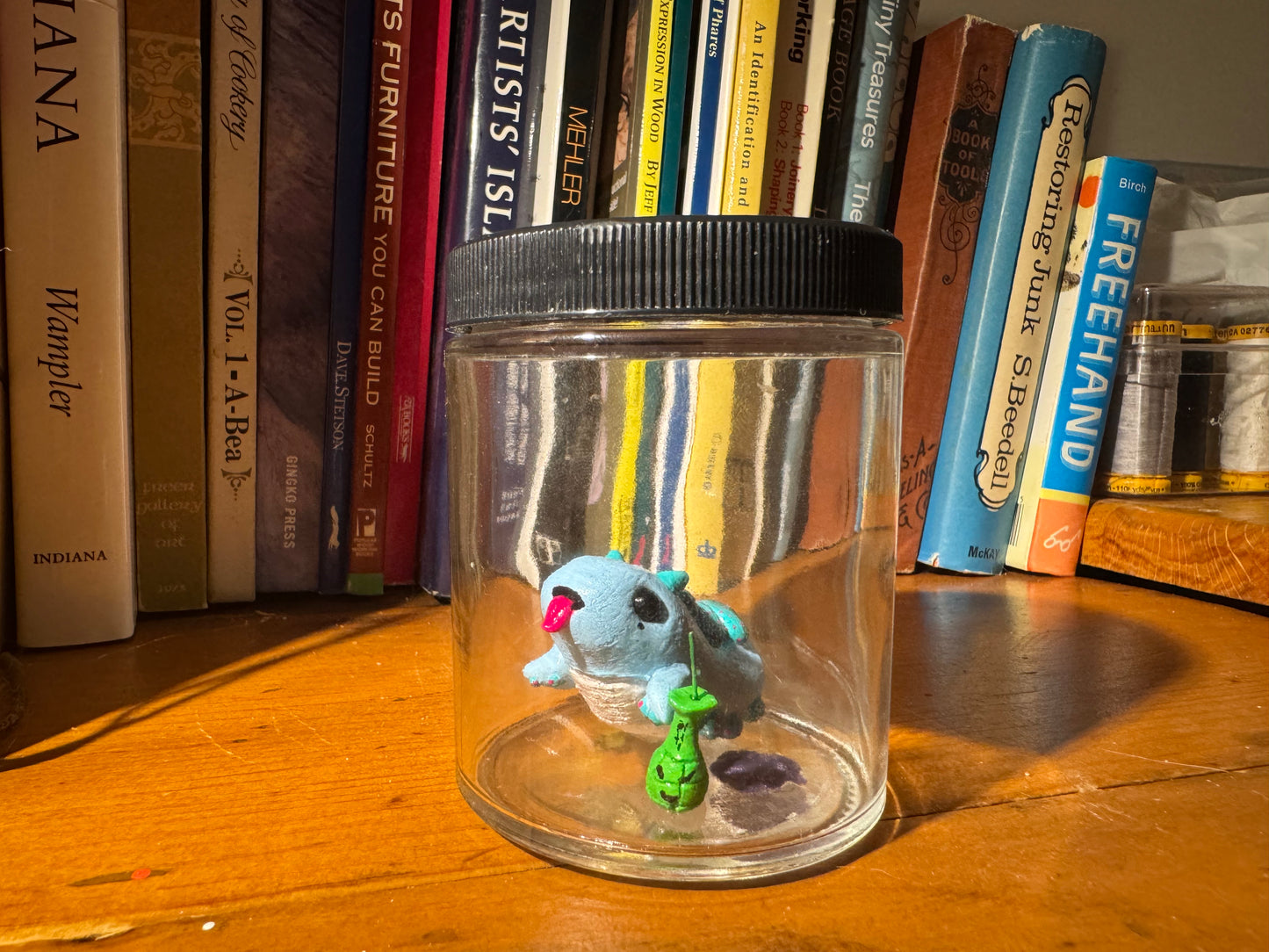 cutie blue creature in a jar