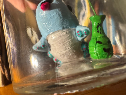 cutie blue creature in a jar